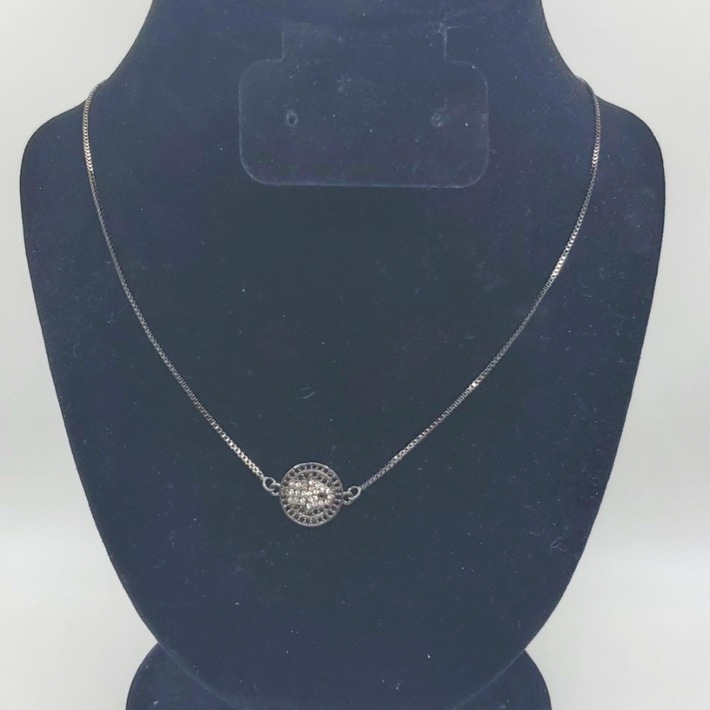 Hamsa hand necklace on a gunmetal  black chain.